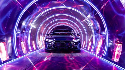 An Audi car drives through a neon tunnel