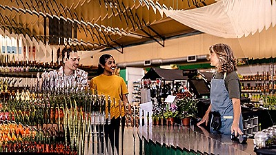 Two people shopping in a grocery store