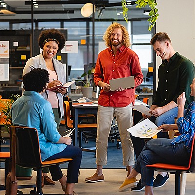 A group of people seated at a table, sharing ideas and interacting with one another.