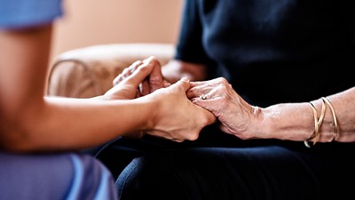 Two people holding hands