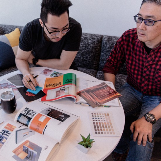 Two men collaborating on a project at Merkle