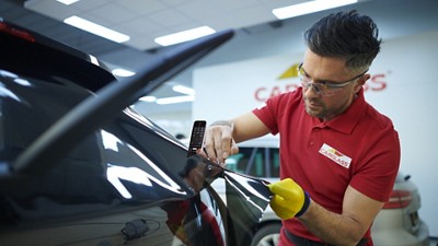 Man working on a car in a garage