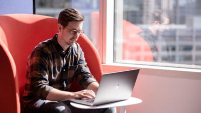 Person sitting at a laptop