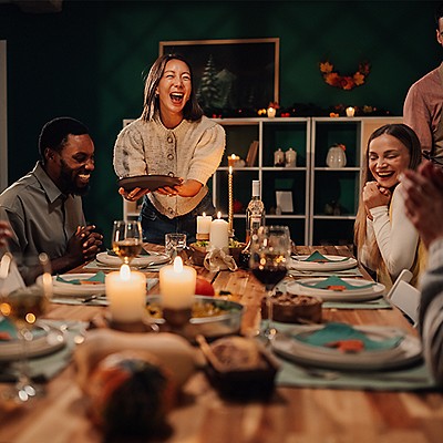 People enjoying a holiday dinner celebration together.