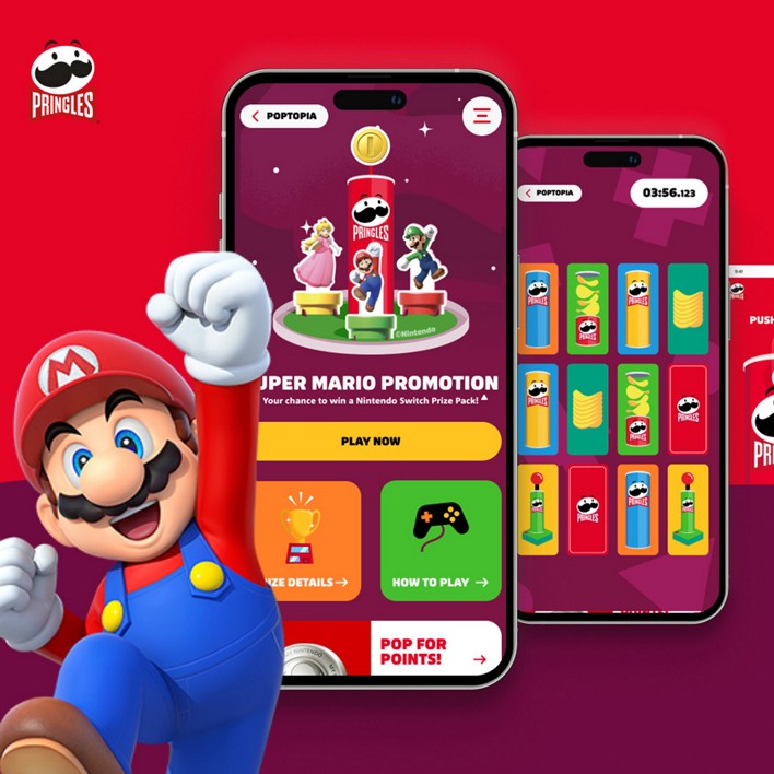Mario punches the air in front of a vibrant, red background featuring two smartphones displaying a Pringles Super Mario promotion, suggesting joy and excitement.