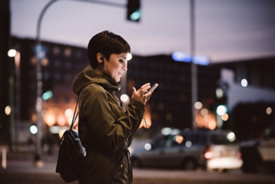 Woman smiling at phone