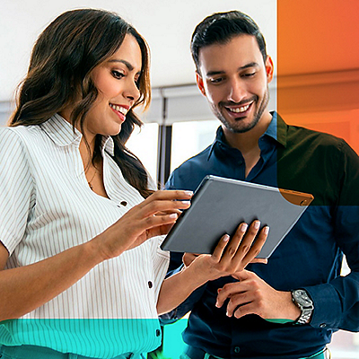 woman and man looking at tablet device