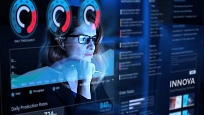 Woman analyzing a virtual dashboard
