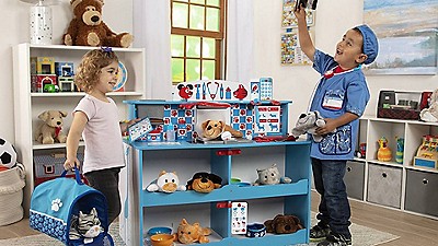 A girl (left) and boy (right) play with Melissa & Doug toys