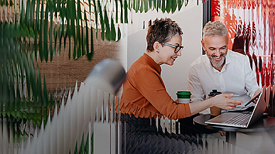 two people looking at a computer