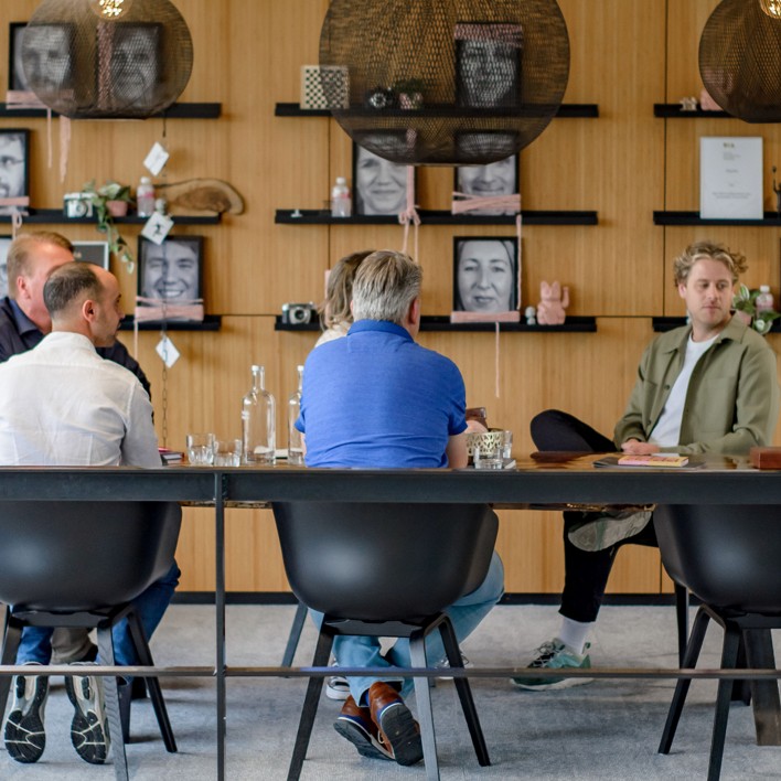 Our colleagues casually talking at our office