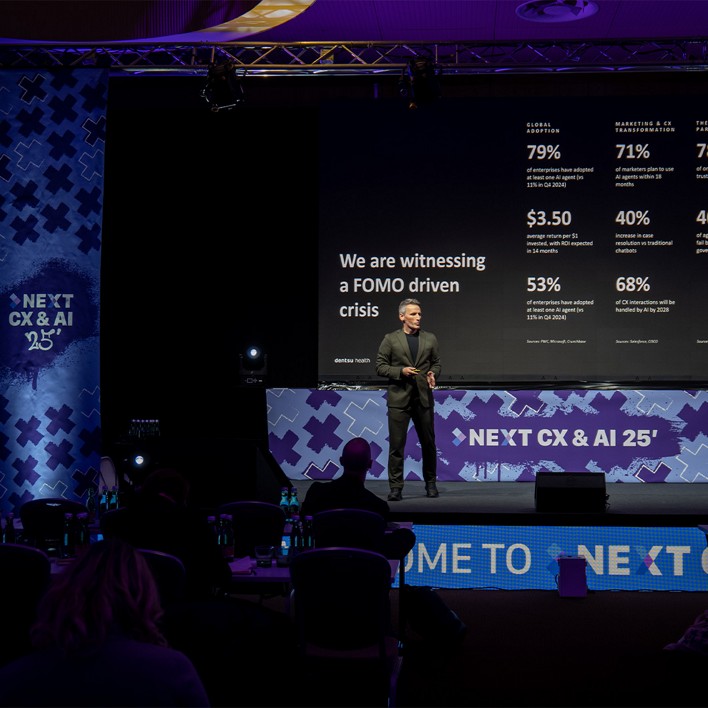 man speaking at a conference