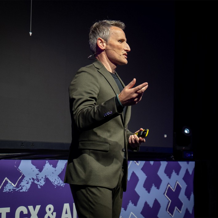 man speaking at a conference