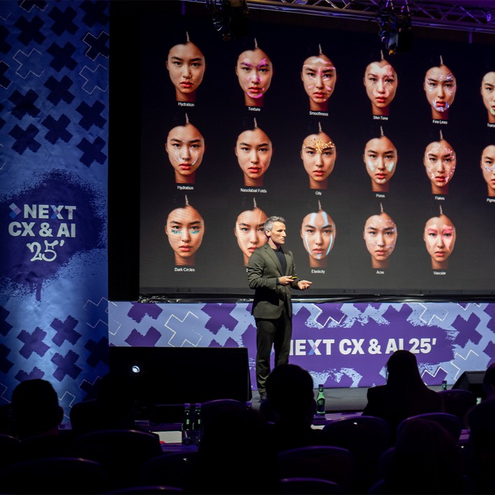 man speaking at a conference