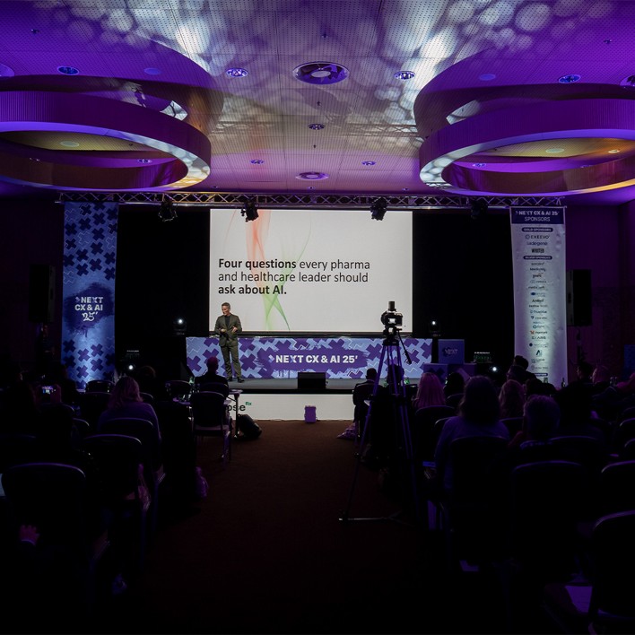 man speaking at a conference