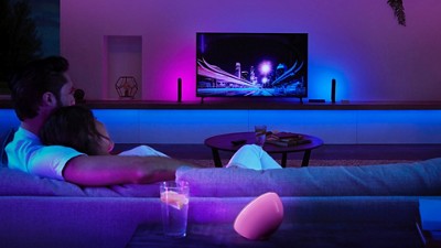 Couple sitting on a couch with ambient lighting