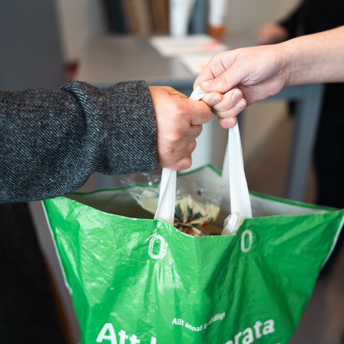 people exchanging groceries
