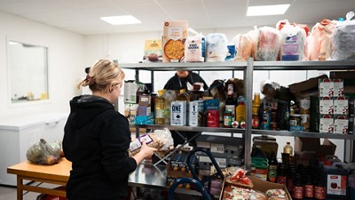 Woman organizing a food pantry