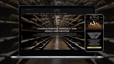 Website with a cheese cellar and the slogan ‘Character cheese refined by cave and master’ shown on a laptop and smartphone.