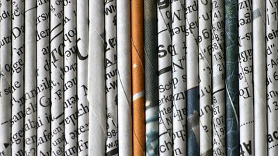 Stacked newspapers 
