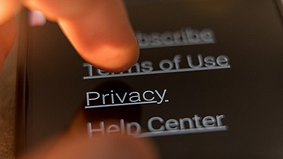 finger scrolling through menu options on mobile device