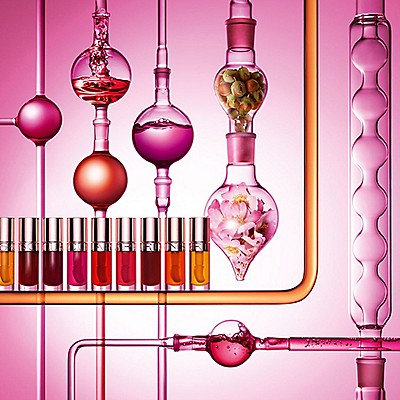 Clarins laboratory setup showcasing cosmetic formulation process with colorful testing solutions and scientific glassware