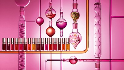 Clarins laboratory setup showcasing cosmetic formulation process with colorful testing solutions and scientific glassware