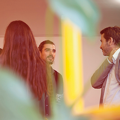A group of people conversing. 