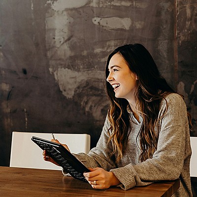A women having a conversation and smiling
