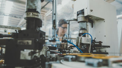 A woman working on laboratory equipment